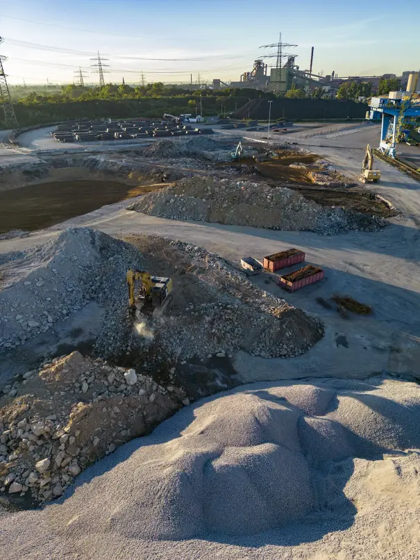 In late summer, excavators prepare the construction site for the direct reduction plant. In late summer, excavators prepare the construction site for the direct reduction plant.