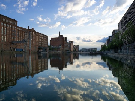 View of Duisburg’s Inner Harbor with historic and modern buildings lining the waterfront.