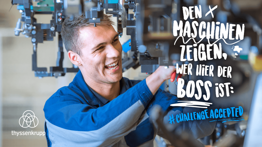 Apprentice at thyssenkrupp Steel working on machinery with tools.