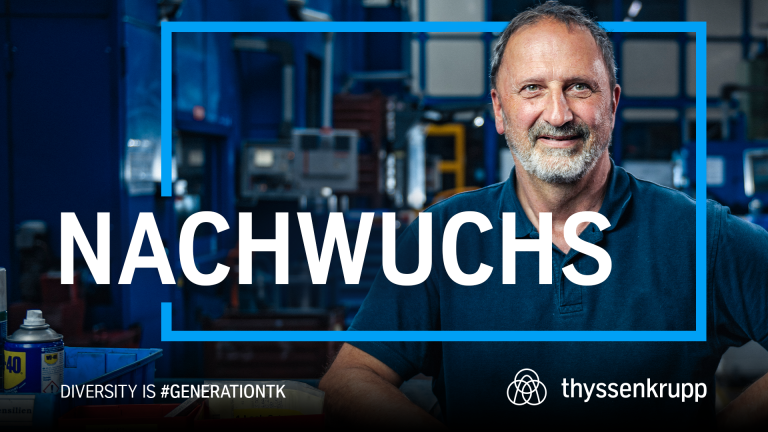 A thyssenkrupp employee in a dark blue T-shirt stands in a workshop. “NACHWUCHS” is boldly displayed across the image. Below: “DIVERSITY IS #GENERATIONTK” and the thyssenkrupp logo. A thyssenkrupp employee in a dark blue T-shirt stands in a workshop. “NACHWUCHS” is boldly displayed across the image. Below: “DIVERSITY IS #GENERATIONTK” and the thyssenkrupp logo.
