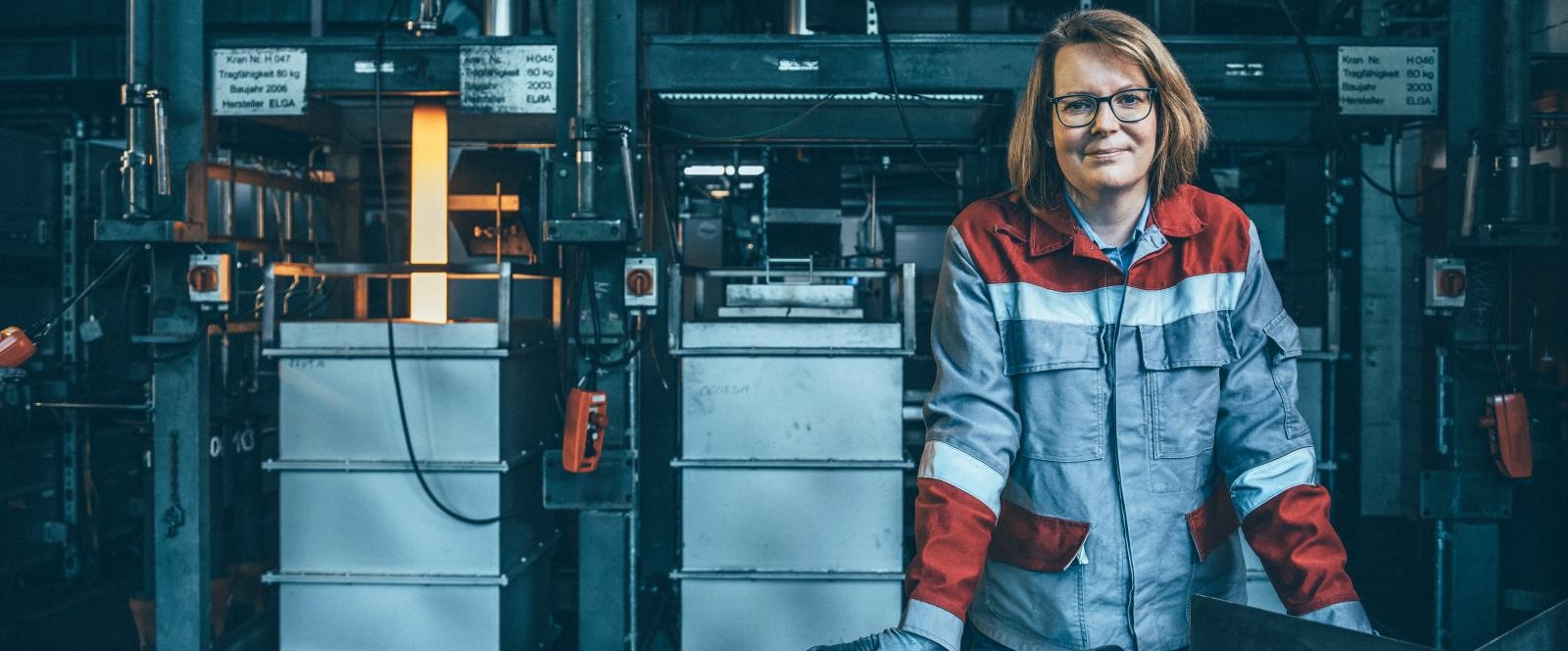 Female employee wearing protective clothing in an industrial environment at thyssenkrupp Steel.  Female employee wearing protective clothing in an industrial environment at thyssenkrupp Steel.