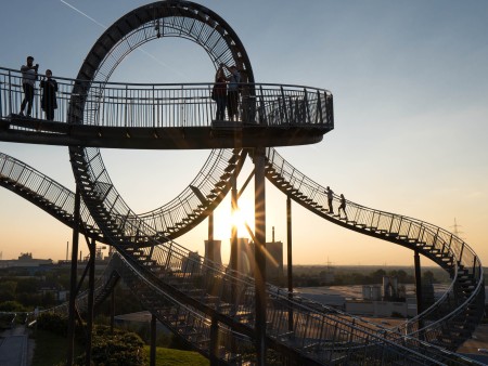 View of the walkable sculpture Tiger and Turtle in Duisburg at sunset.